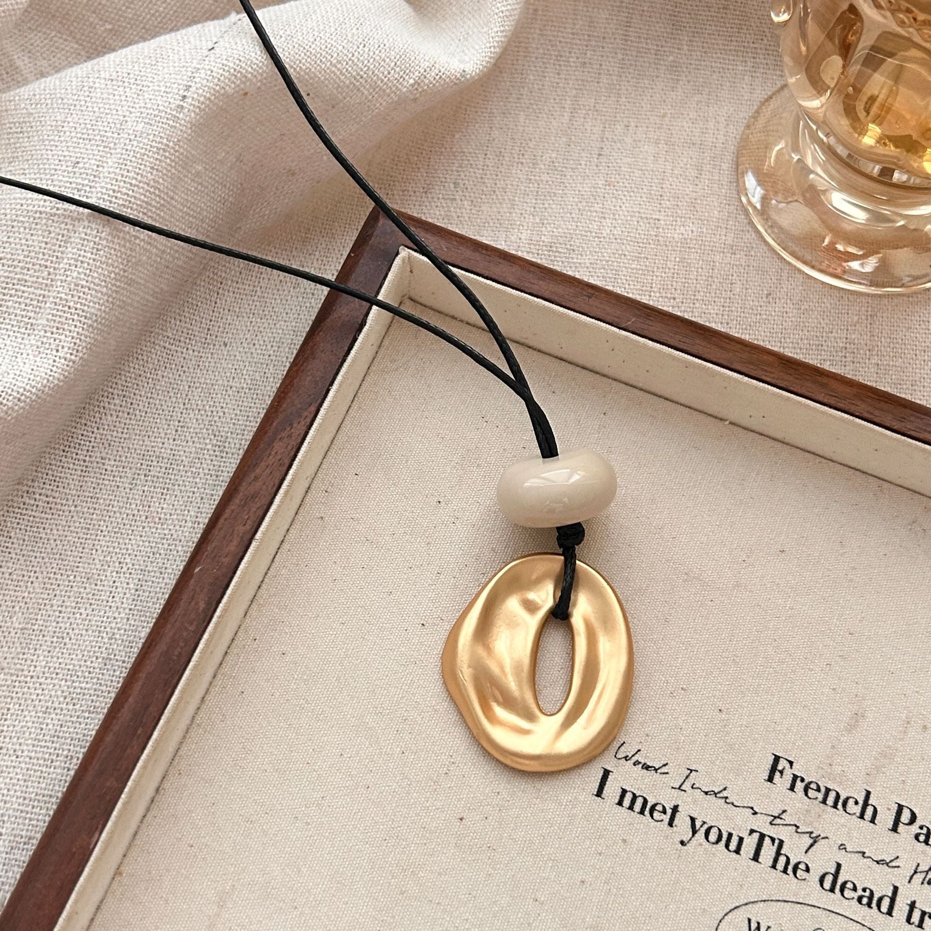 Irregular matte openwork oval pendant long necklace