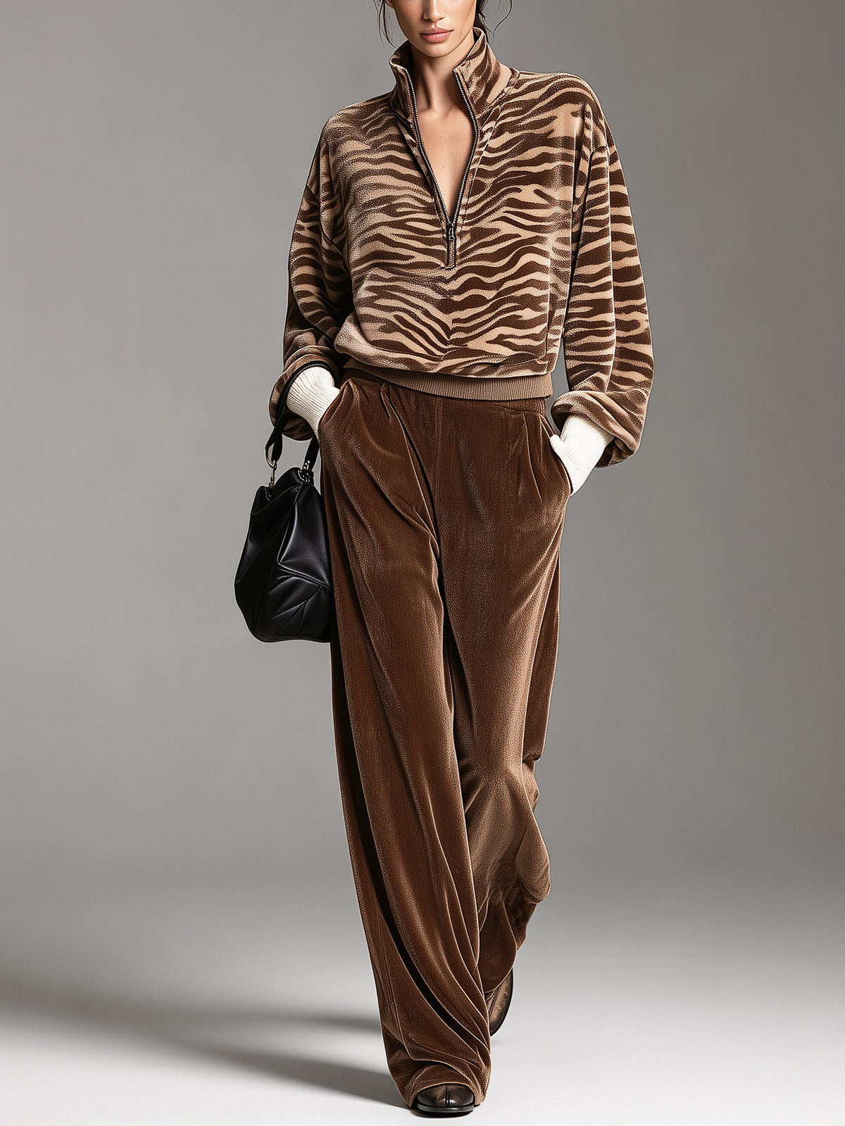 Brown tiger-stripe half-zip sweatshirt and velvet-textured wide-leg pants set