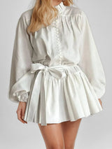 Elegant long-sleeved tie-neck printed dress